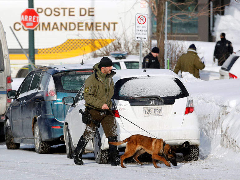 Police officers patrol the perimeter at the scene of a fatal shooting at the Quebec Islamic Cultural Centre in Quebec City, Canada, on Jan. 30, 2017. Photo courtesy of Retuers/Mathieu Belanger