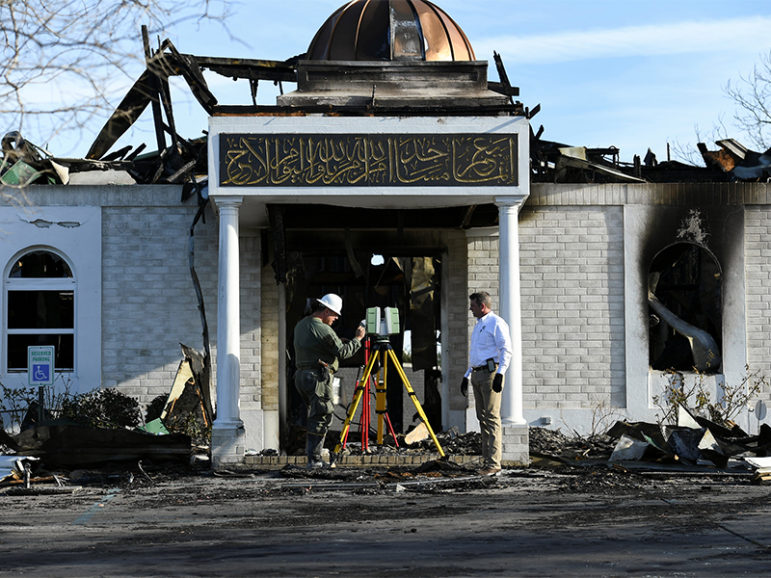 Security officials investigate the aftermath of a fire at the Victoria Islamic Center mosque in Victoria, Texas, on Jan. 29, 2017.  Photo courtesy of Reuters/Mohammad Khursheed