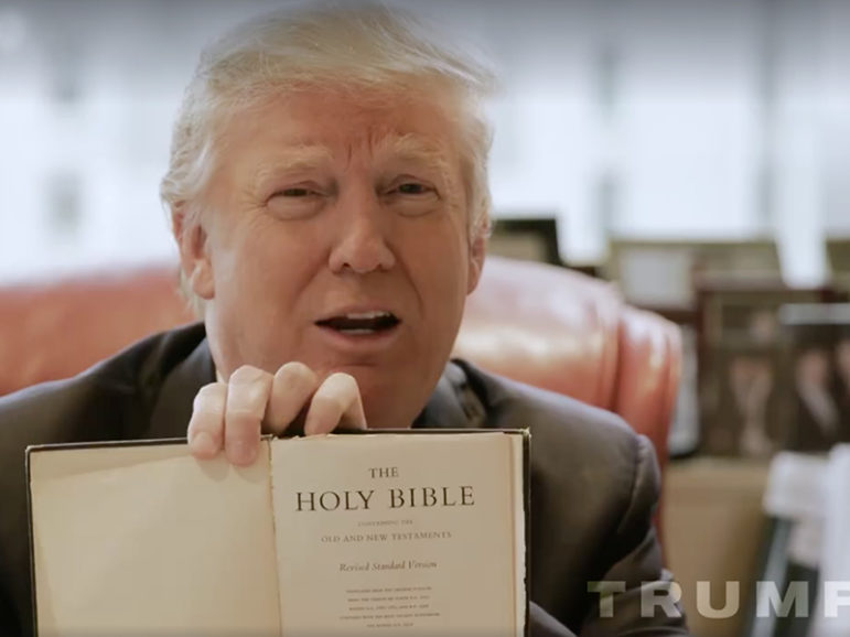 Candidate Donald Trump shows a Bible his mother gave him in a campaign video.  Trump used the family Bible to take the oath of office on Inauguration Day. Photo from video screenshot