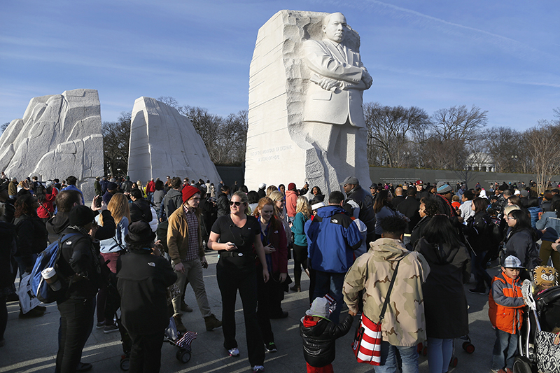 People visit the Martin Luther King Jr. Memorial on the U.S. national holiday in his honor, in Washington, on Jan. 20, 2014. King, the civil rights leader who 50 years ago received the Nobel Peace Prize, was assassinated in Memphis, Tennessee in 1968. Photo courtesy of Reuters/Jonathan Ernst