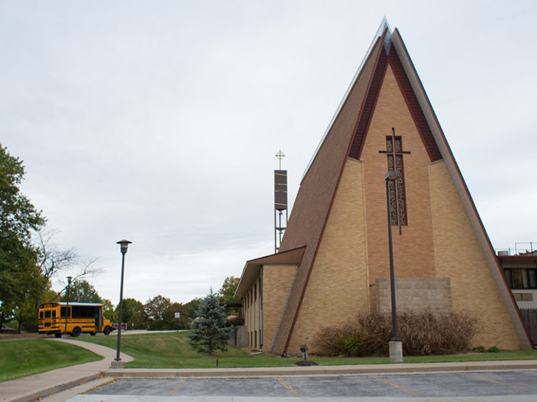 A school bus arrives at Trinity Lutheran Church in Columbia, Mo., on the morning of Oct. 18, 2016. RNS photo by Sally Morrow