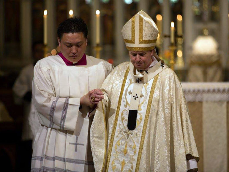 Archbishop of Sydney Anthony Fisher, right, during the Feast of Corpus Christi Mass on May 29, 2016.  Photo courtesy of the Archdiocese of Sydney