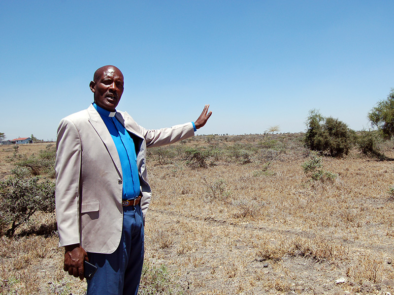 Pastor Stephen Lenku Tipatet of the Presbyterian Outreach Mission Church shows the plains he traverses while preaching in Isinya, Kajiado County, in southern Kenya on Jan. 3, 2017. RNS photo by Fredrick Nzwili