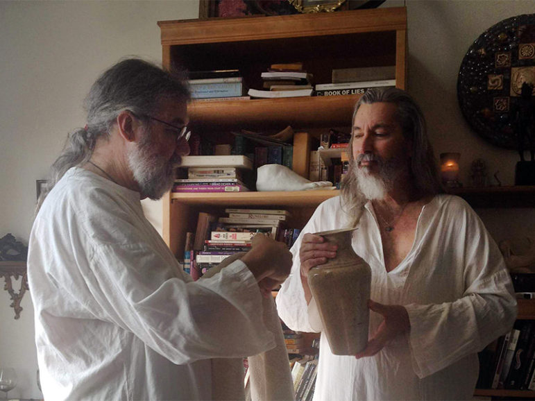 Dean Cameron, left, and partner Peter Thomas participate in domestic worship at their home in North Hollywood, Calif. They offer food and drinks to the 12 ancient Greek gods. Photo courtesy of Dean Cameron