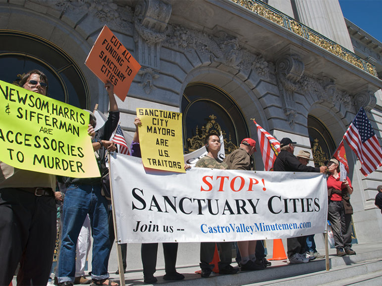 A group protesting sanctuary cities demonstrates in front of City Hall in San Francisco on July 30, 2008. Photo courtesy of Creative Commons/Steve Rhodes