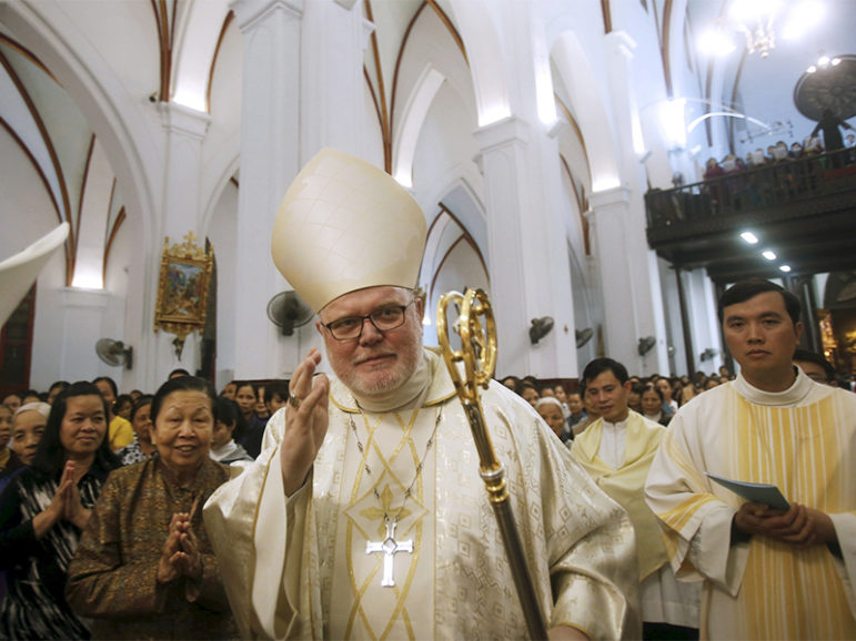 German Cardinal Reinhard Marx, archbishop of Munich, blesses Catholics before a Sunday Mass on Jan. 10, 2016, at St. Joseph Cathedral in Hanoi during a visit to Vietnam. Photo courtesy of Reuters/Kham