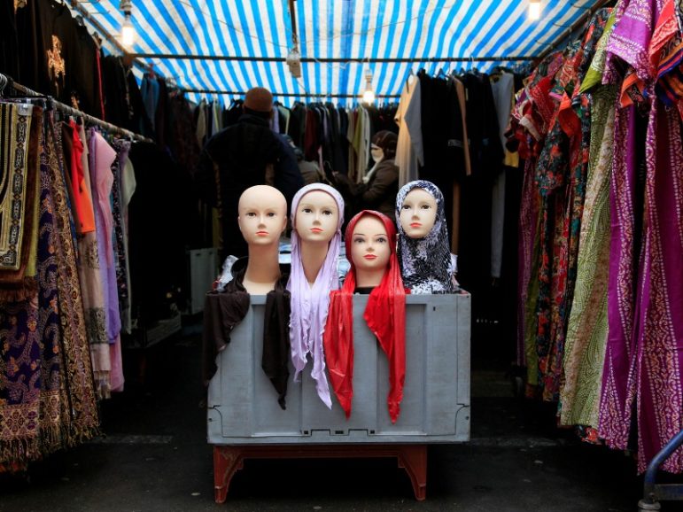 People look at a market stall selling the hijab on Jan. 20, 2011, in east London. File photo by Stefan Wermuth/Reuters