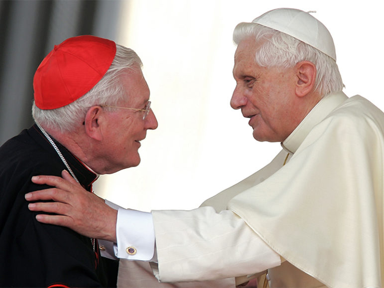 Then-Pope Benedict XVI embraces Cardinal William Henry Keeler, left, at the end of the pope's weekly general audience in St. Peter's Square at the Vatican on June 28, 2006.  Photo courtesy of Reuters/Max Rossi