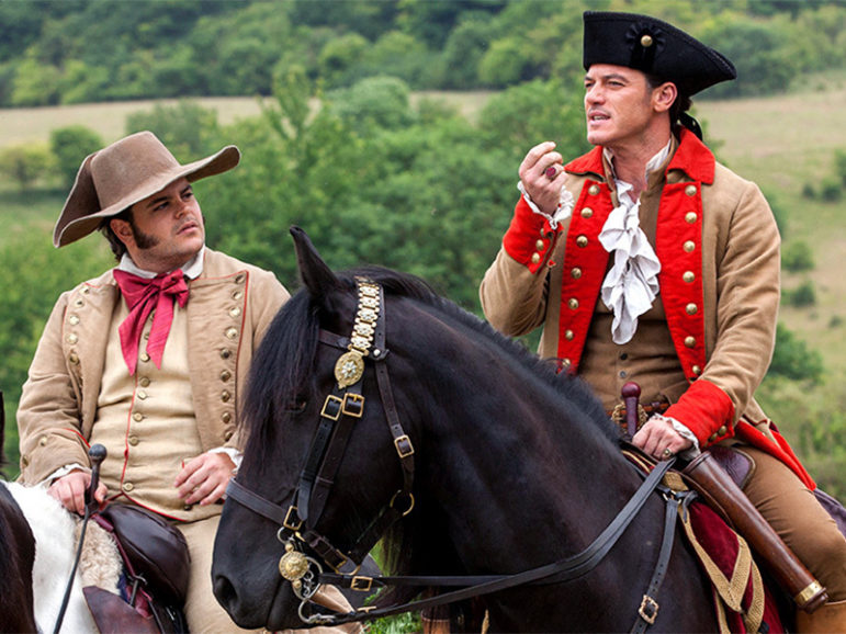 Actor Josh Gad as Lefou, left, and actor Luke Evans as Gaston in the 2017 live-action version of Disney’s “Beauty and the Beast” movie. Image courtesy of Disney