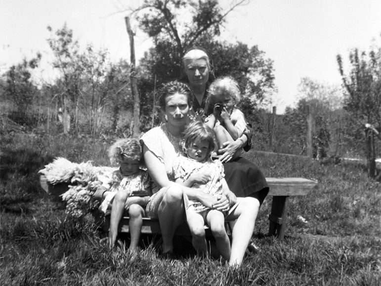 Dorothy Day, back, holds grandson Eric, while Tamar Hennessy, center, holds Becky, with Susie sitting to the left in West Virginia in 1949. Photo courtesy of the Hennessy Family Collection