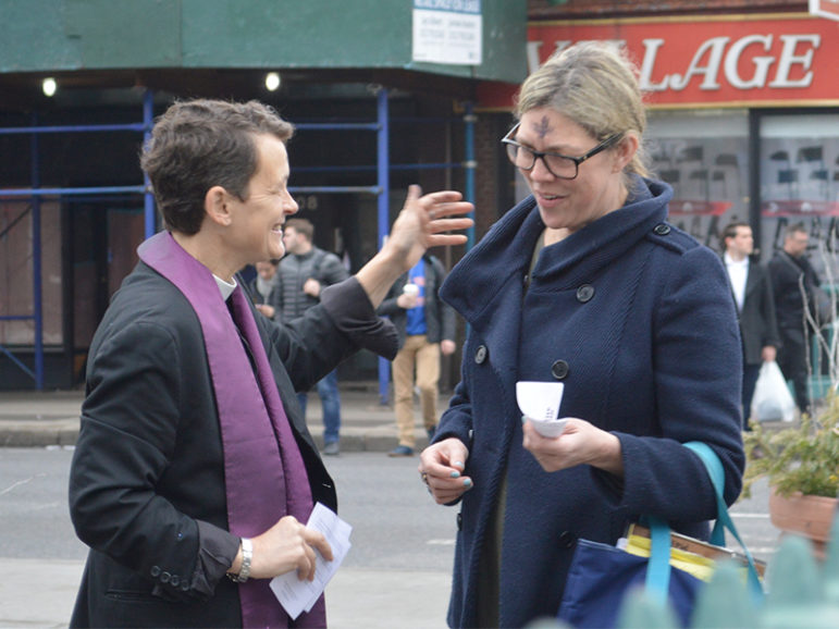The Rev. Elizabeth M. Edman, left, distributes glitter ashes near Stonewall Inn in New York City for Ash Wednesday on March 1, 2017. Photo courtesy of Cathy Renna