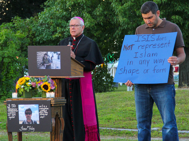 Bishop of Manchester, Peter Anthony Libasci, speaks during a vigil on for slain journalist James Foley at the Rochester Commons in Rochester, N.H., on Aug. 23, 2014.  Photo by Shawn St. Hilaire/Democrat Photo