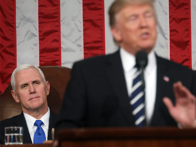Vice President Mike Pence, left, listen as President Trump delivers his first address to a joint session of Congress from the floor of the House of Representatives in Washington, D.C., on Feb. 28, 2017.  Photo courtesy of Reuters/Jim Lo Scalzo/Pool