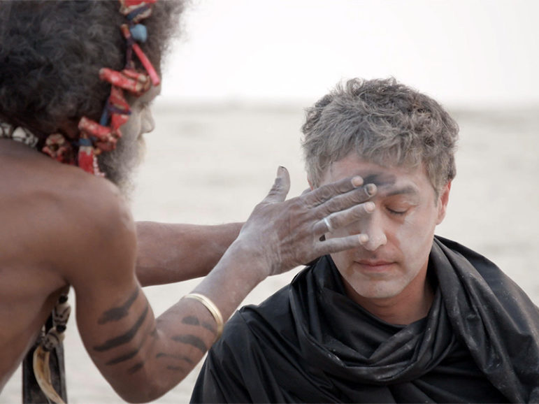 “Believer” host Reza Aslan has ashes smeared on his face by an Aghori ascetic who takes part in extreme displays of defilement. Photo courtesy of CNN