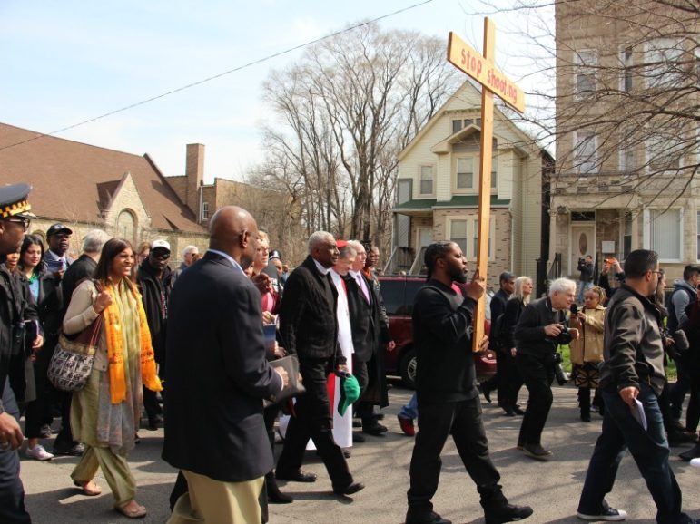 Cardinal Blase Cupich led the Good Friday Walk for Peace April 14, 2017, through Chicago's Englewood neighborhood, a community that has been scarred by gun violence. He was joined by more than 1,500 neighbors and interfaith and civic leaders as he walked the traditional Stations of the Cross. RNS photo by Emily McFarlan Miller