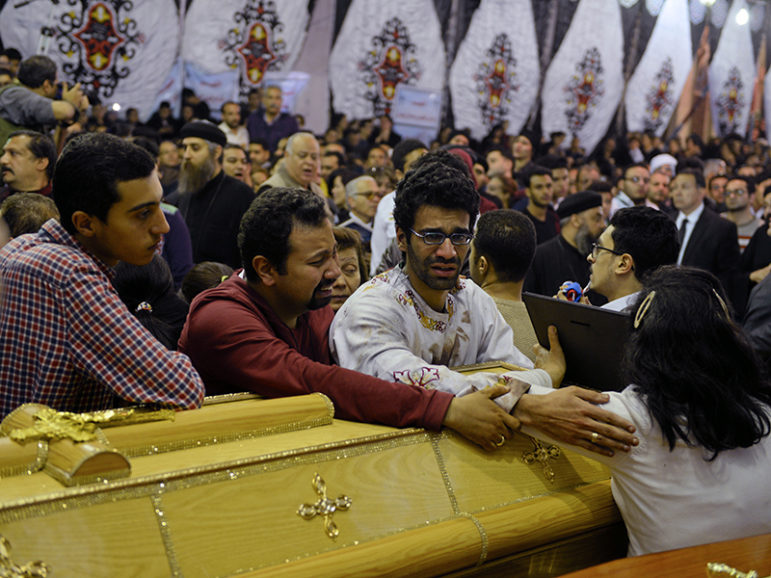 Relatives of victims react next to coffins arriving to the Coptic church that was bombed on Sunday in Tanta, Egypt, April 9, 2017. Photo courtesy of REUTERS/Mohamed Abd El Ghany