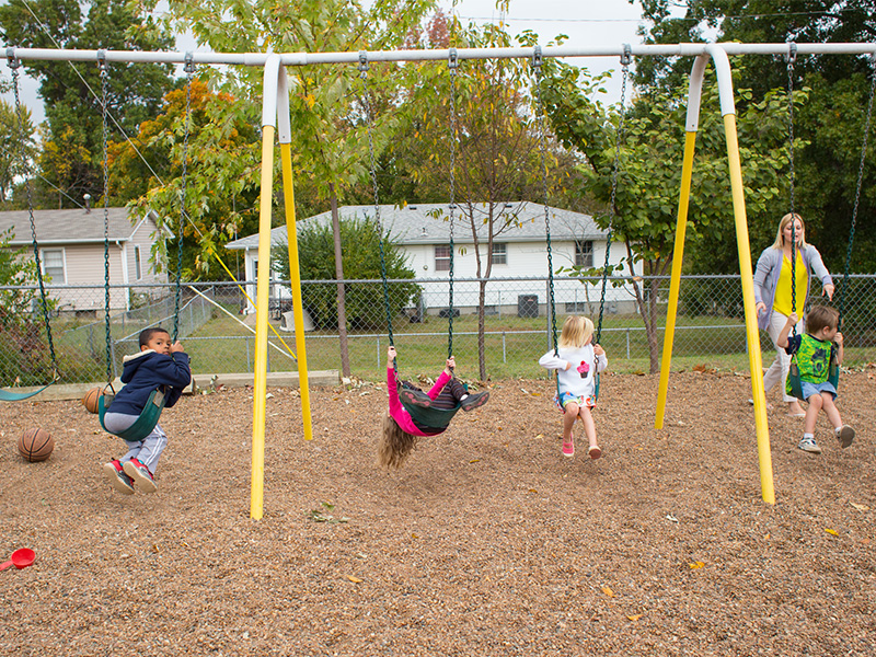 Children play on a gravel playground at Trinity Lutheran Church’s Child Learning Center in Columbia, Mo., on Oct. 18, 2016. RNS photo by Sally Morrow