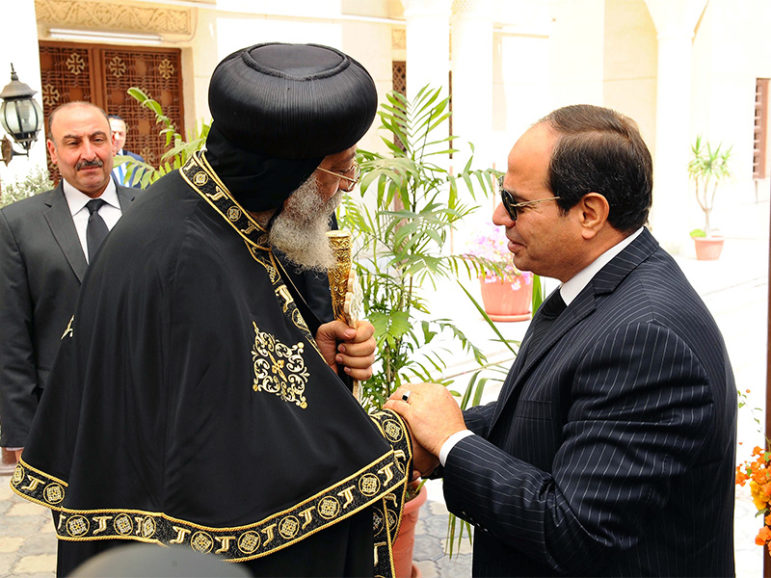 Egyptian President Abdel-Fattah el-Sissi, right, shakes hands with Pope Tawadros II, the 118th pope of the Coptic Orthodox Church of Alexandria and patriarch of the See of St. Mark Cathedral, to offer condolences for the victims of the terrorist incidents of the Palm Sunday bombings in Tanta and Alexandria, in the Abassiya Cathedral in Cairo, on April 13, 2017. Photo courtesy of The Egyptian Presidency/Handout via Reuters
