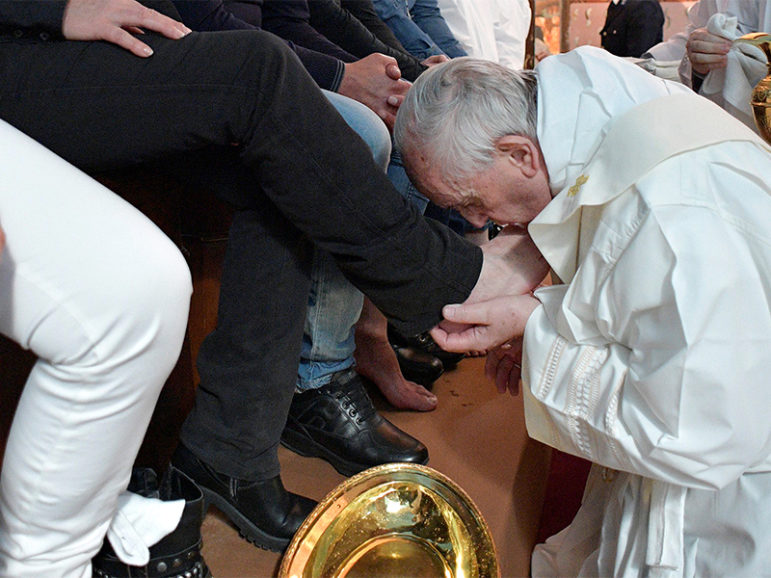 Pope Francis washes the feet of some inmates at the Paliano prison, south of Rome, on April 13, 2017. Photo courtesy of Osservatore Romano via Reuters