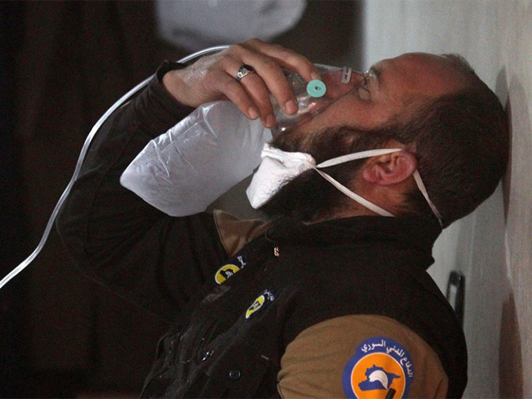 A civil defense member breathes through an oxygen mask after what rescue workers described as a suspected gas attack in the town of Khan Sheikhoun in rebel-held Idlib, Syria, on April 4, 2017. Photo courtesy of Reuters/Ammar Abdullah
*Editors: This photo may only be republished with RNS-POPE-SYRIA, originally transmitted on April 5, 2017.