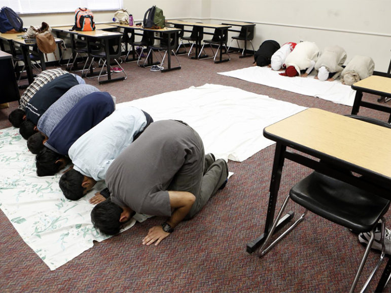 Muslim students gather to pray inside a classroom at Liberty High.  Photo courtesy of Lara Solt/KERA News