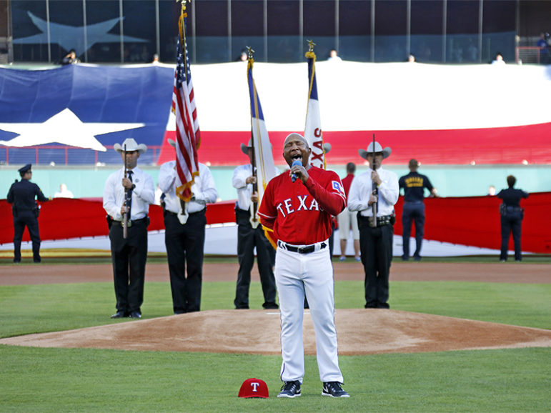 Texas Rangers third base coach Tony Beasley sings the national anthem before the team's opening-day game against the Cleveland Indians on April 3, 2017. Photo courtesy of Louis DeLuca/Texas Rangers
