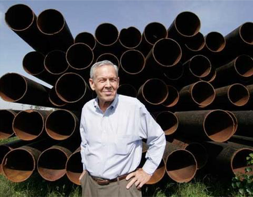 David Howell in front of the pipes he salvages.