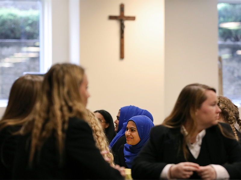 Students from the MDQ Academy Islamic School and Saint Anthony's High School sit in a cafeteria during a field trip at the Roman Catholic school in Huntington, New York, on April 26, 2017. Photo courtesy of Reuters/Shannon Stapleton