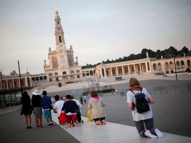 Pilgrims walk on their knees to fulfil their vows at the Sanctuary of Our Lady of Fátima in Fátima, Portugal, on May 8, 2017. Photo courtesy of Reuters/Rafael Marchante