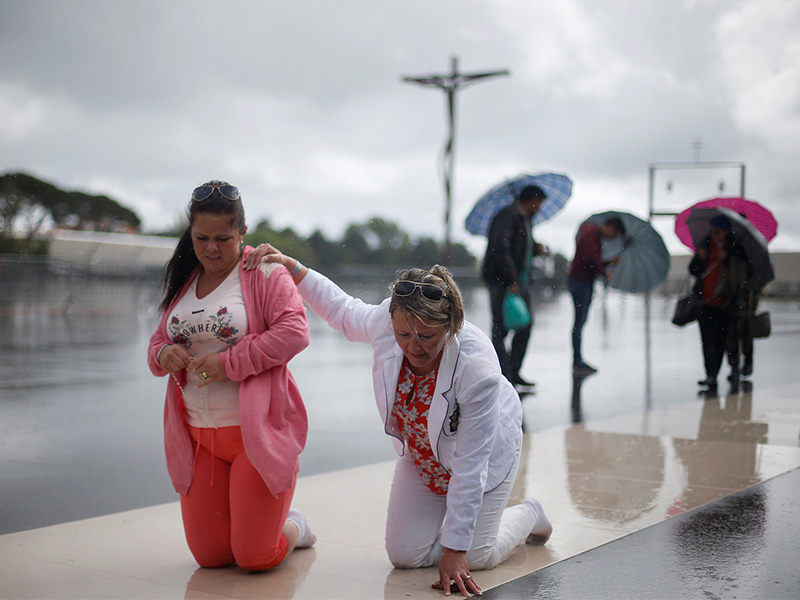 On the day before the arrival of Pope Francis, pilgrims walk on their knees to fulfil their vows at the Catholic shrine of Fatima, Portugal, on May 11, 2017. Photo courtesy of Reuters/Rafael Marchante