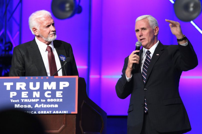 Pastor Tom Anderson and then-Governor Mike Pence speaking with supporters at a campaign rally and service at the Living Word Bible Church in Mesa, Arizona. | Credit: Gage Skidmore/Flickr (cc)