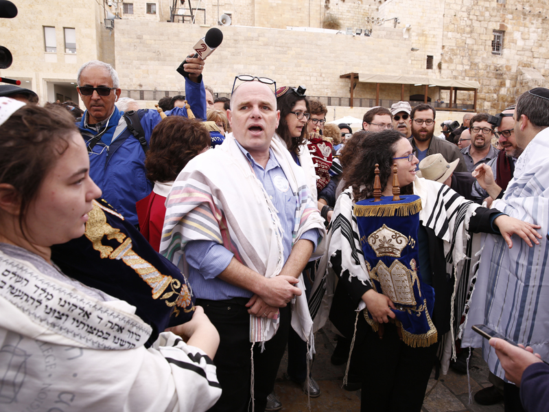 Yizhar Hess, who heads the Conservative/Masorti movement in Israel (center-left) and other members of his movement gathered at in the Western Wall plaza. Photo courtesy the Masorti movement
