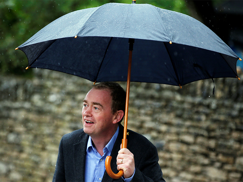 Tim Farron, leader of Britain's Liberal Democrat Party, arrives at a polling station in Kendal, Britain, on June 8, 2017. Photo courtesy of Reuters/Andrew Yates