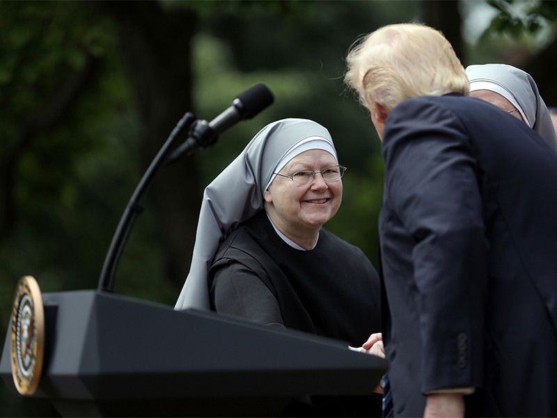 President Trump shakes hands with a nun of the Little Sisters of the Poor during a National Day of Prayer event at the Rose Garden of the White House  on May 4, 2017. Photo courtesy of Reuters/Carlos Barria
