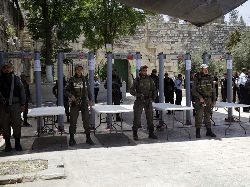 Israeli border police officers stand guard on July 16, 2017, near metal detectors at the entrance to the Al Aqsa Mosque compound in Jerusalem. A dispute over metal detectors has escalated into a new showdown between Israel and the Muslim world over a contested Jerusalem shrine that has been at the center of violent confrontations in the past. (AP Photo/Mahmoud Illean)