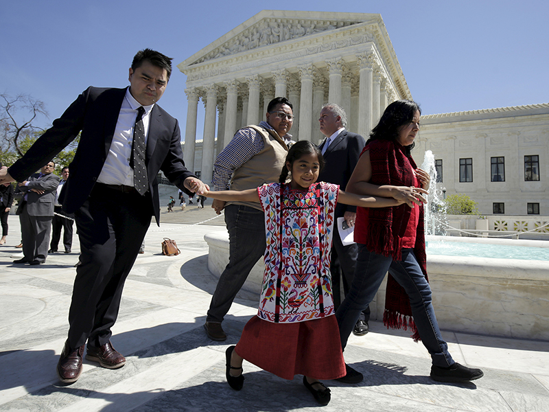 Sophie Cruz, 6, walks with her father, Raul Cruz, left, after arguments in a challenge by 26 states over the constitutionality of President Obama's executive action to defer deportation of certain immigrant children and parents who are in the country illegally at the Supreme Court in Washington on April 18, 2016. Photo courtesy of REUTERS/Joshua Roberts
*Editors: This photo may only be republished with RNS-SEITZ-OPED, originally transmitted on July 3, 2017.