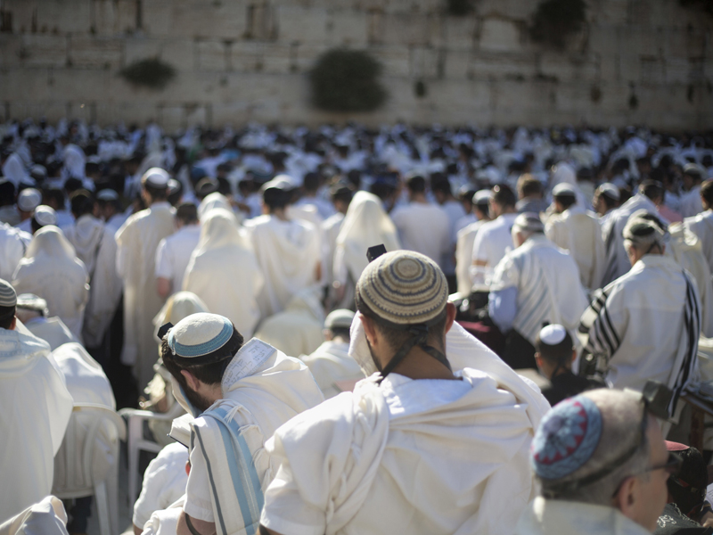 In this May 24, 2017, file photo, Jewish men pray at the Western Wall, the holiest place where Jews can pray, in Jerusalem's Old City. Israel's rabbinical authorities have compiled a list of overseas rabbis whose authority they refuse to recognize when it comes to certifying the Jewishness of someone who wants to get married in Israel. The list, obtained by The Associated Press, includes a number of prominent Orthodox rabbis and is another sign of a deepening rift between overseas Jewish communities and Israeli religious authorities. (AP Photo/Ariel Schalit, File)