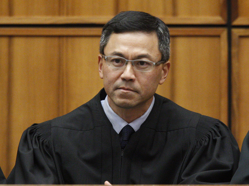 This Dec. 2015 file photo shows U.S. District Judge Derrick Watson in Honolulu. Watson on July 13, 2017, expanded the list of family relationships needed by people seeking new visas from six mostly Muslim countries to avoid President Donald Trump's travel ban. Watson ordered the government not to enforce the ban on grandparents, grandchildren, brothers-in-law, sisters-in-law, aunts, uncles, nieces, nephews and cousins of people in the United States. (George Lee /The Star-Advertiser via AP, File)