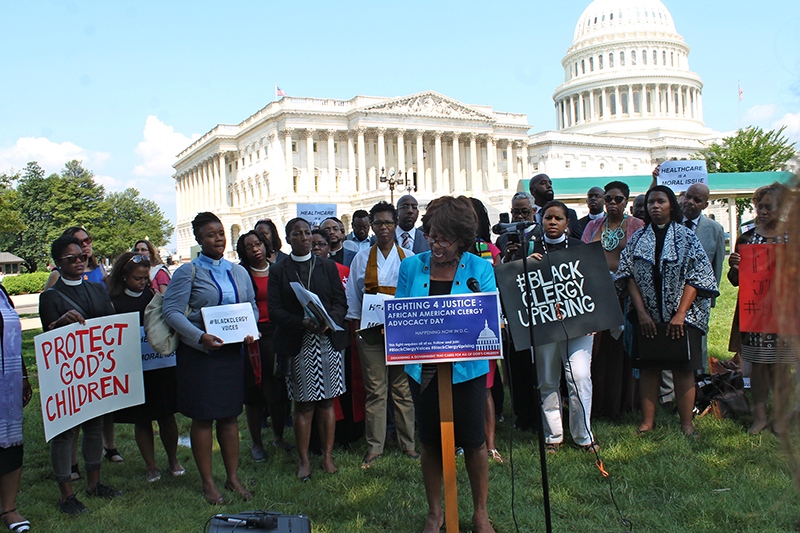 U.S. Rep. Maxine Waters speaks to an ecumenical group of African-American clergy outside the U.S. Capitol on July 18, 2017. RNS photo by Madeleine Buckley