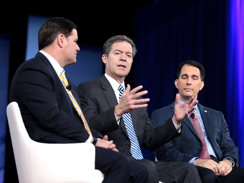 Kansas Governor Sam Brownback, center, joins other state governors on a panel during the 2017 Conservative Political Action Conference (CPAC) in National Harbor, Maryland, on Feb. 23, 2017.  Photo courtesy of Gage Skidmore/Creative Commons