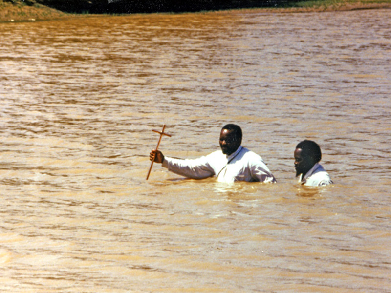 A river baptism in South Africa in 1987. Many charismatic churches in Africa perform baptisms in rivers. Photo courtesy of Larry Hills/Mennonite Church USA/Creative Commons
