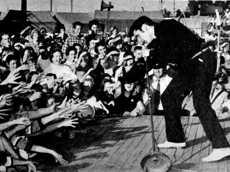 Elvis Presley performs at the Mississippi-Alabama Fairgrounds in Tupelo, Miss., on Sept. 26, 1956.  Photo courtesy of Creative Commons/Radio TV Mirror