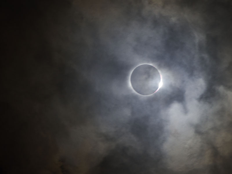 The diamond ring shines through clouds as the totality of the solar eclipse ends in Liberty, Mo., on August, 21, 2017. RNS photo by Kit Doyle