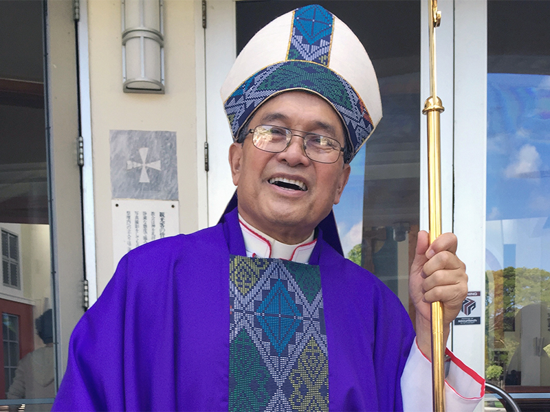 Archbishop Anthony Apuron stands in front of the Dulce Nombre de Maria Cathedral Basilica in Hagatna, Guam, in November 2014. The U.S. territory of Guam, where almost everyone is Catholic, has been ripped apart by claims the archbishop abused altar boys. Apuron has denied allegations he molested multiple altar boys. (AP Photo/Grace Garces Bordallo)