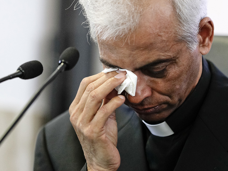 The Rev. Tom Uzhunnalil wipes tears from his eyes after a moment of commotion during a news conference on his recent rescue from Yemeni militants, in Rome, Sept. 16, 2017. Uzhunnalil had worked for more than four years as a chaplain at the home in Aden in southern Yemen established by Mother Teresa's Missionaries of Charity and was abducted by militants in March 2016 when they attacked the home, killing 16 people, including four nuns. (AP Photo/Andrew Medichini)