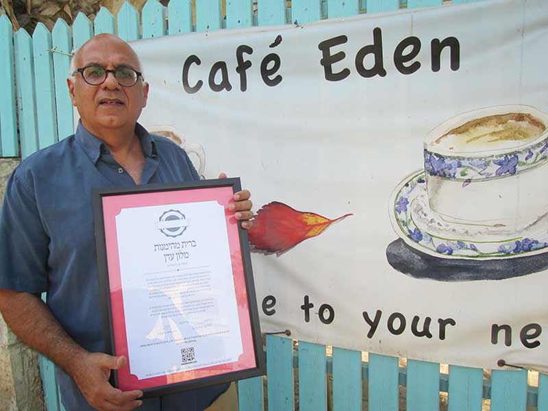 Yuval Djamchid, the owner of a small Jerusalem hotel and on-site café, is relieved that the High Court will allow him and other restaurateurs without a rabbinate kosher food certificate to share their kashrut standards with prospective diners. Photo by Michele Chabin