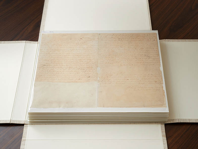 The first couple of pages of the printer's manuscript of the Book of Mormon are enclosed by folding the casing and then by sliding it into an additional case. Photo courtesy of the Corporation of the President of The Church of Jesus Christ of Latter-day Saints