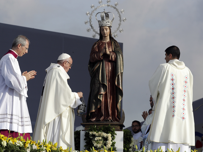 Next to an image of the Virgin of Immaculate Conception, Pope Francis celebrates Mass at the Simon Bolivar park in Bogota, Colombia, on Sept. 7, 2017. (AP photo/Andrew Medichini)