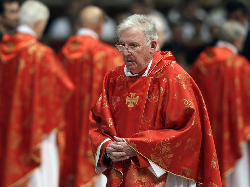 British Cardinal Cormac Murphy O'Connor attends a Mass for the election of a new pope inside St. Peter's Basilica, at the Vatican, on March 12, 2013. (AP Photo/Andrew Medichini)