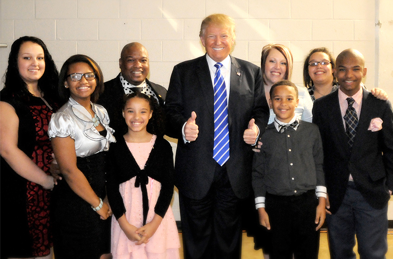 Pastor Mark Burns' family with candidate Trump. Photo by Gene Ho Photography